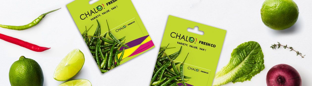 Chalo Freshco giftcards beside fruits and vegetables